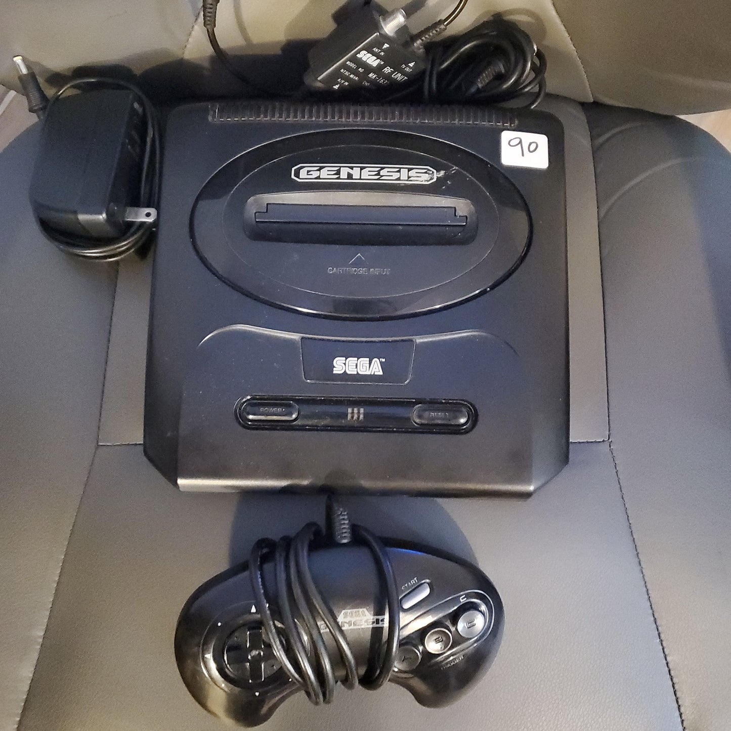 Sega Genesis with cables and controller